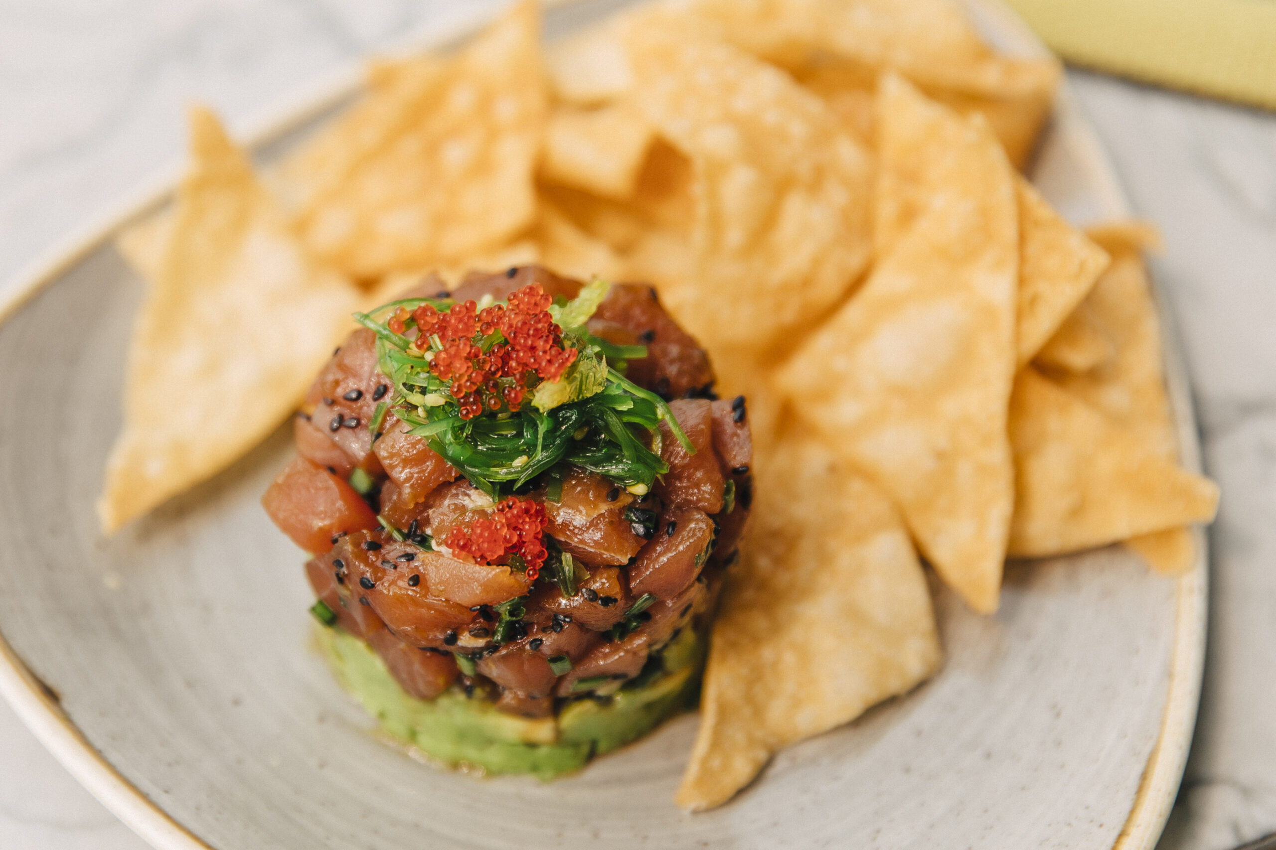 tuna tartare with guacamole and chips